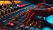 A detailed close-up of a person's hand operating a sound mixer. This image can be used to depict audio production, music mixing, sound engineering, or recording equipment