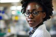 In the cutting-edge laboratory, the accomplished afro-American woman scientist passionately explores the realms of science and medicine, embodying expertise and innovation. 
