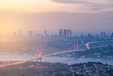 Istanbul Bosphorus Bridge at sunset and evening lights with colorful clouds in the sky