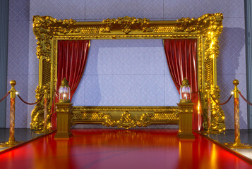 Wall Mural - red carpet with gold barriers leading to golden frame and two lanternes, 3D render