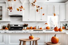 White Modern Kitchen Decorated For Fall With Orange Pumpkins And Leaves
