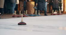 Curling With Wooden Ice Stock Curling Stone Game In The Winter Time