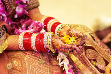 Flower in hand of hindu bride, hindu wedding culture, chura in bride hand 