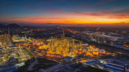 Poster - Aerial view of the morning of the oil refinery from the drone of the tower of the Petrochemistry industry in the oil​ and​ gas​ ​industry with​ cloud​ sun orange​