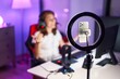 © Krakenimages.com - Young beautiful hispanic woman streamer having video call at gaming room