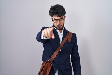 Sticker - Hispanic man with beard wearing business clothes pointing displeased and frustrated to the camera, angry and furious with you