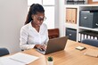 © Krakenimages.com - African american woman business worker using laptop working at office