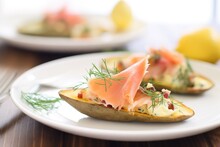 Closeup Of Potato Skins Topped With Smoked Salmon And Dill