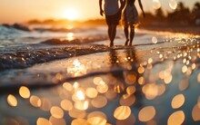 A Joyful Couple Shares Moments Of Fun And Happiness On The Beach, With The Soft, Defocused Bokeh Light Adding A Touch Of Magic To Their Seaside Experience.