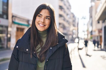 Sticker - Young beautiful hispanic woman smiling confident looking to the side at street