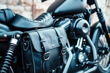 Dark Leather Saddle Bags With Black Buckles On A Motorcycle