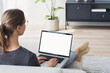 © kite_rin - Young woman using laptop computer with blank empty mockup screen. Business woman working at home. Freelance, student lifestyle, e-learning, shopping online, web site, technology concept