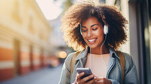Young mixed race woman smiling happy using smartphone and headphones at the city.