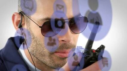 Poster - Animation of data processing and media icons over caucasian male security guard using walkie talkie