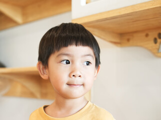 Wall Mural - Little asian boy looking his left side