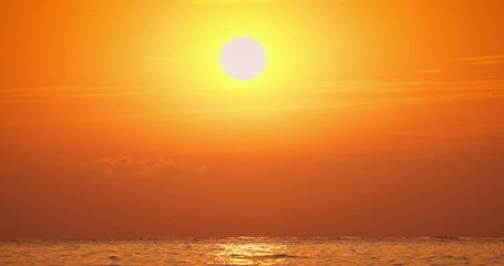 Wall Mural - color golden sunrise or sunset over sea horizon and ripple water waves 4k video