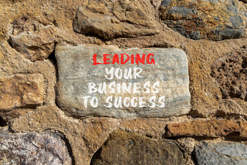 Wall Mural - Leading your business to success symbol. Concept words Leading your business to success on beautiful stone. Beautiful stone wall background. Leading your business to success concept. Copy space