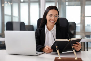 Sticker - Smiling lawyer working at table in office