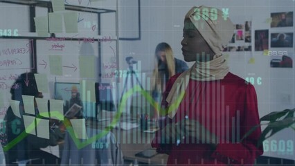 Wall Mural - Animation of data processing on graph over african american casual businesswoman brainstorming