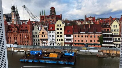 Wall Mural - City old town. View of the rudder of the port city and the water canal from the window. Gdańsk, Poland