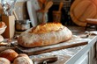 © Jelena - Freshly baked sourdough bread cooling on a rustic kitchen counter