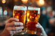© Andrii  - Close-Up Shot: Beer Glasses Clinking
