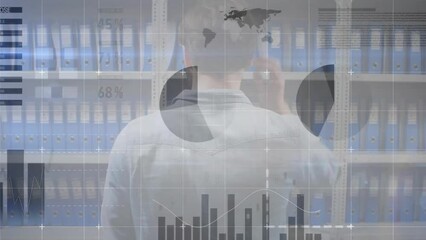 Poster - Animation of data processing on charts over caucasian casual businessman looking at files on shelves