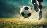 Fototapeta Sport - Foot of soccer player kicking football ball on amazing grass stadium.