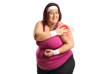 Wall Mural - Plus size woman in sportswear with red inflamed shoulder