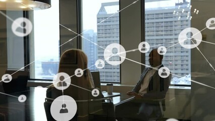 Poster - Animation of network of people icons over diverse male and female colleague talking at office