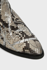 Wall Mural - Pointy toe of grey women's fashion cossack Cowboy boot in python snake skin leather isolated on white background. Female classic spring autumn shoe with heel. Footwear in animal print. Close up