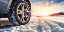 Winter Driving On Icy Road Close Up Of Vehicle Car Transport Tire In Snow Background Landscape