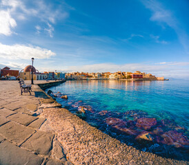 Wall Mural - Chania with the amazing lighthouse, mosque, venetian shipyards, at sunset, Crete, Greece.