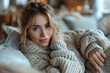 © Gonzalo - Profile photo of nice minded lady sitting couch arm touch chin living room flat indoors