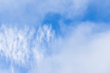 Wall Mural - white clouds in blue sky, natural background photo
