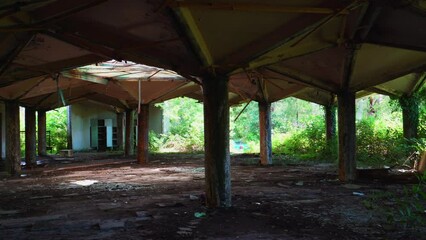 Wall Mural - Abandoned building with columns and stained glass window in roof. Deserted lost place, no people.