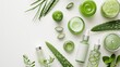 Flat lay of aloe skincare products, jars and bottles with aloe vera leaves on white background
