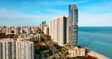 Diverse Buildings In The Architecture Of Miami Beach. Sunny View Of American City On The Coast Of The Atlantic Ocean.