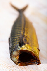 Wall Mural - Fragrant smoked mackerel on wooden background. Traditional product of Russian cuisine