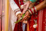Fototapeta Na ścianę - Indian Hindu wedding ceremony ritual items and hands close up