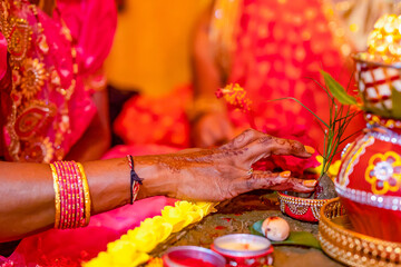 Indian Hindu wedding ceremony ritual items and hands close up