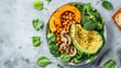 Healthy vegan lunch bowl with Avocado, mushrooms, broccoli, spinach, chickpeas, pumpkin on a light background. vegetables salad. Top view