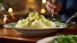 Closeup of creamy mashed potatoes being carefully piped onto a plate by a renowned chef in a live cooking webinar.