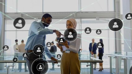 Poster - Animation of network of connections with icons over diverse business people in office