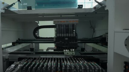 Poster - Automatic pick and place machine is installing components on circuit board. Creative. Assembly line on electronics and circuit board manufacturing factory.
