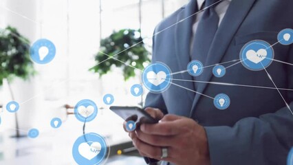 Poster - Animation of network of connections with icons over caucasian businessman using smartphone