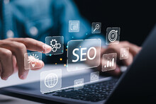 Businessman Use Laptop To Analyze SEO Search Engine Optimization For Promoting Ranking Traffic On Website And Optimizing Your Website To Rank In Search Engines.
