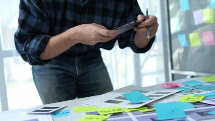 UX developers, UI designers think about designing creative mobile app interface layouts Application planning sketch Prototype development process with customer code and color code online business work