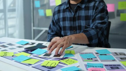 UX developers, UI designers think about designing creative mobile app interface layouts Application planning sketch Prototype development process with customer code and color code online business work