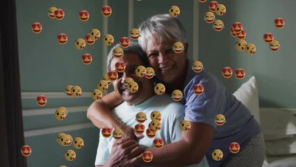 Poster - Animation of emoji icons over senior biracial couple embracing